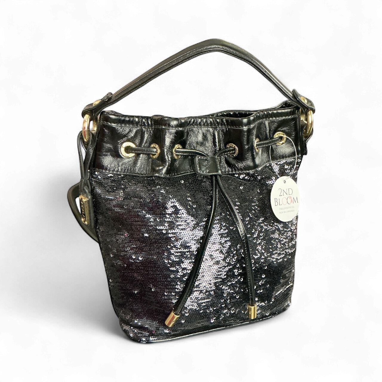 Bolso Coach Poppy Cinch – Lentejuelas negras con forro fucsia