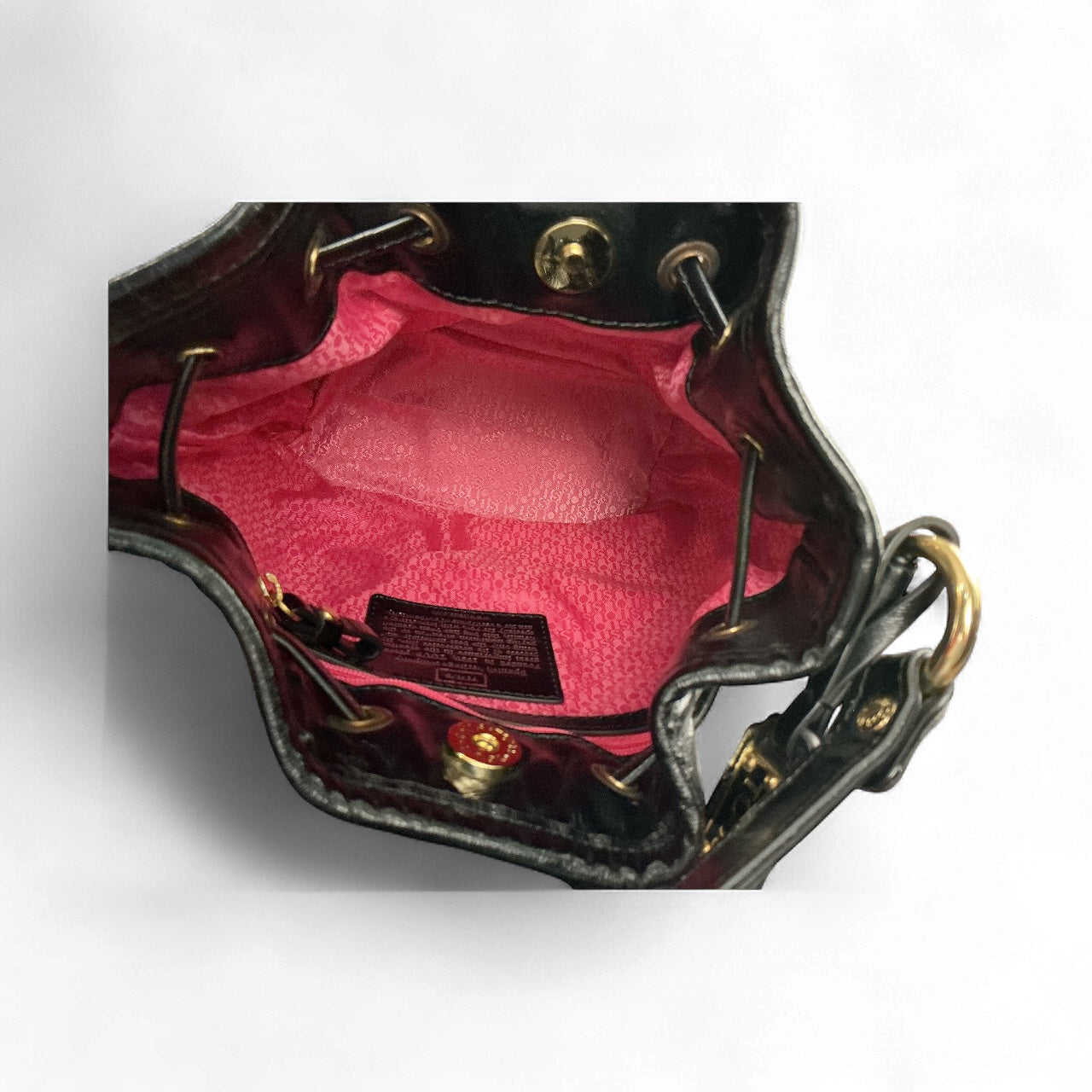 Bolso Coach Poppy Cinch – Lentejuelas negras con forro fucsia