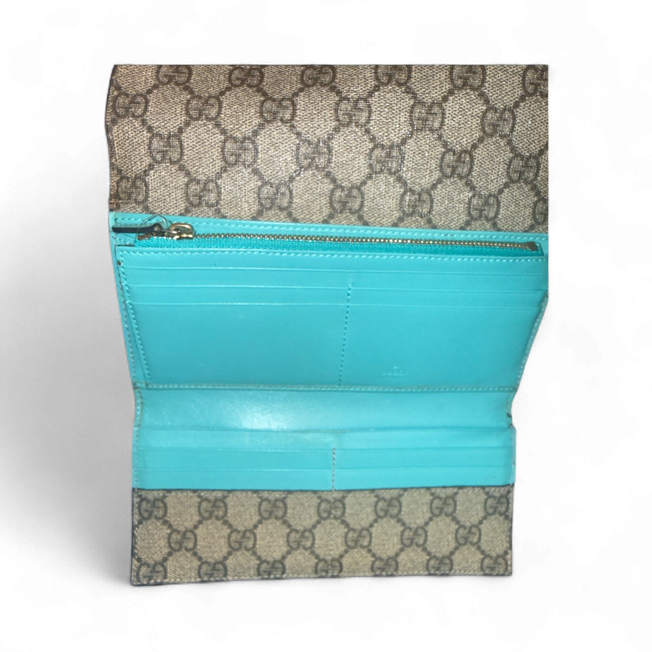 Cartera continental Gucci GG Supreme en beige/ébano con interior turquesa