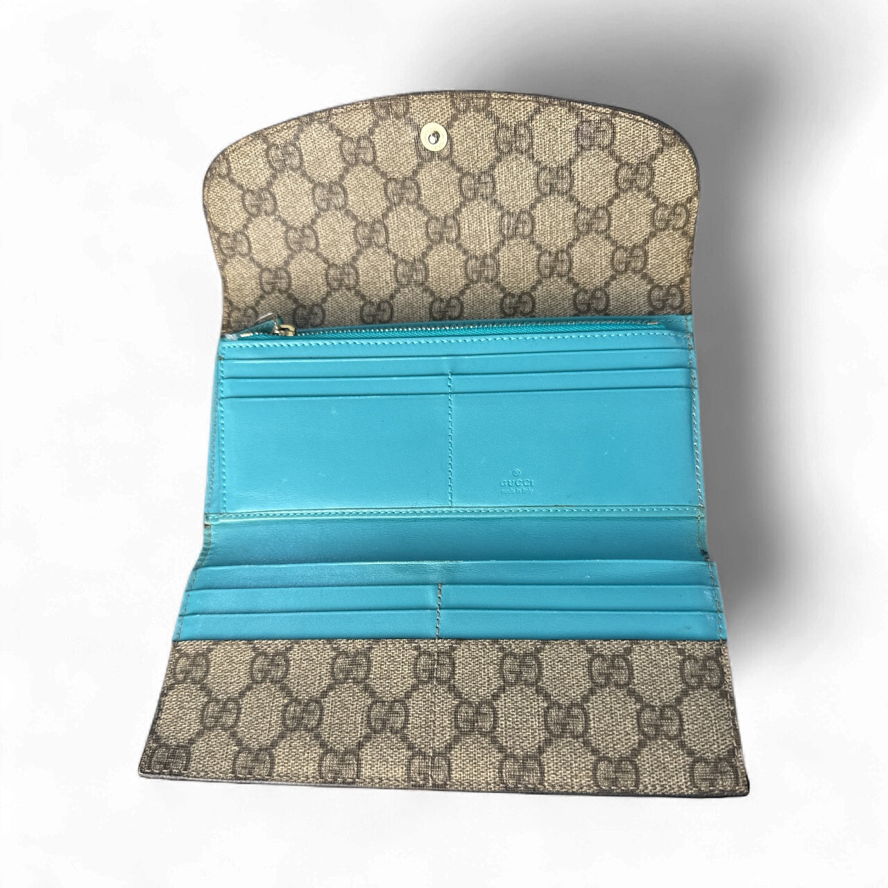 Cartera continental Gucci GG Supreme en beige/ébano con interior turquesa